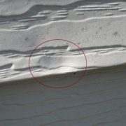 Aluminum siding with hail damages 2